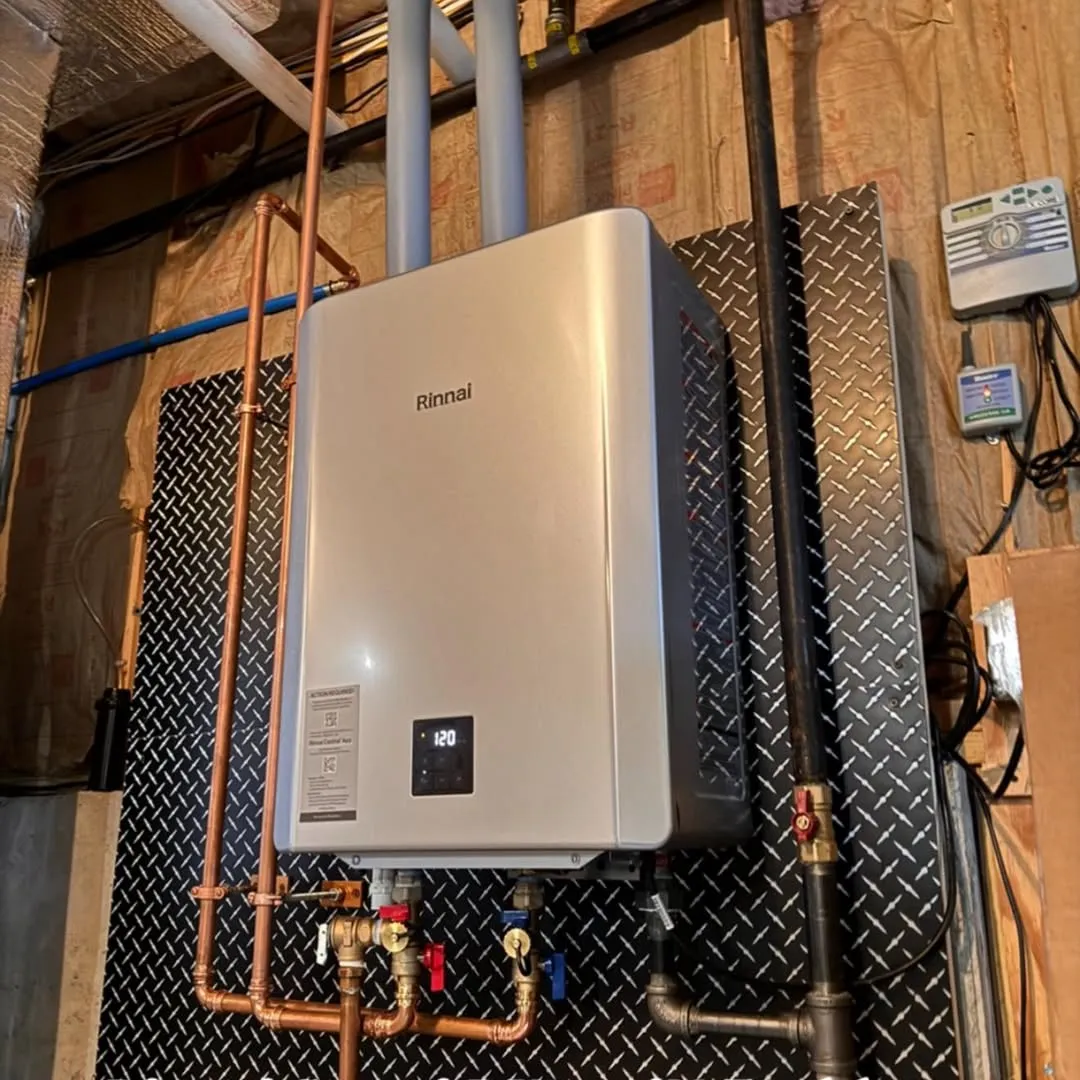 Rinnai tankless water heater installation on a diamond-plate backer