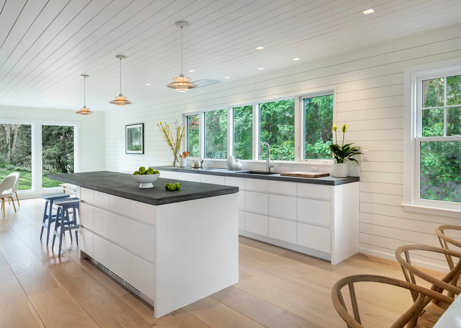 Kitchen with shiplap ceiling, island and window wall