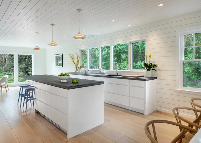 Kitchen with shiplap ceiling, island and window wall