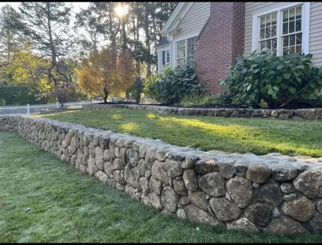 Natural stone wall and lawn