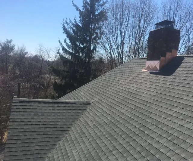 gray asphalt asphalt shingles and chimney with new flashing in connecticut