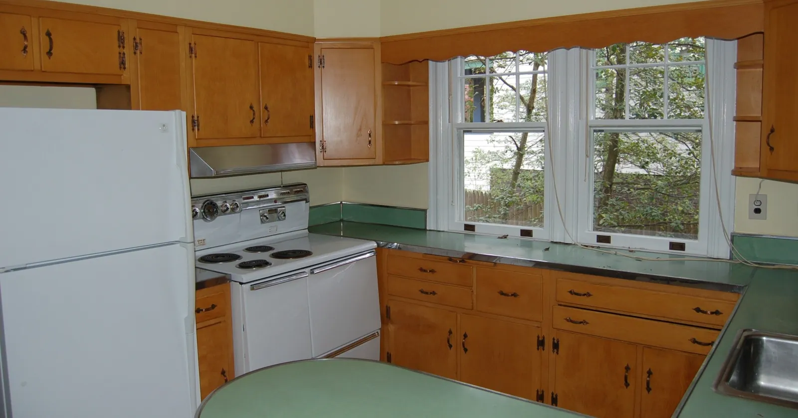 Same kitchen, same window. This one went from 1950s maple cabinets and mint green laminate to inset cabinetry, a soapstone island and a range that means business. 

cabinjohnbuilders.com

#beforeandafter #kitchenrenovation #customhomes #renovation #homebuilder #marylandhomes #dmv