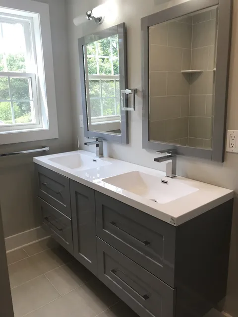 Floating double vanity with a tiled shower