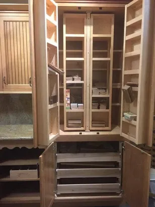 Kitchen cabinet remodeling with lots of drawers and storage.