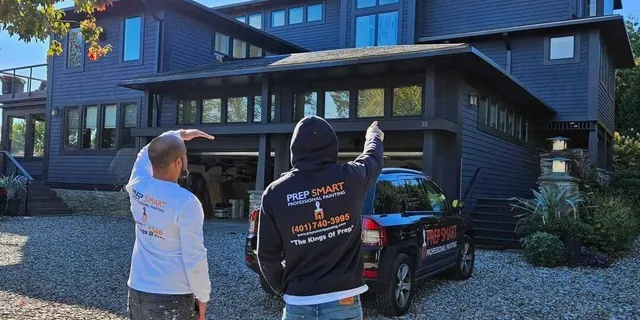 prep smart painting team looking at exterior of home