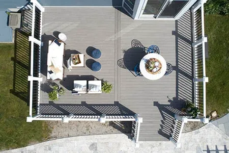 Aerial view of composite deck with outdoor furniture and privacy screens