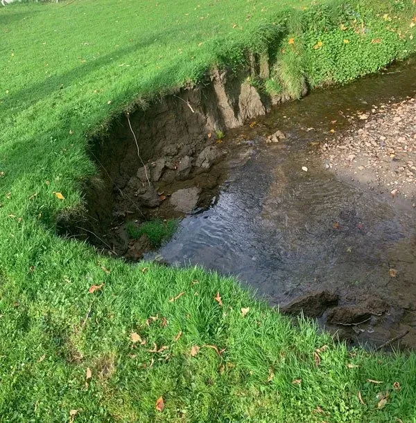 before: erosion from stream