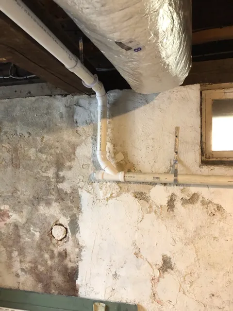 New PVC drain routing in basement ceiling