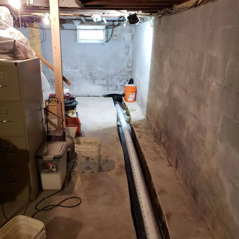Interior basement waterproofing and drain line