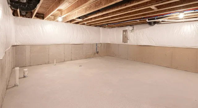 Clean dry basement interior after waterproofing installation