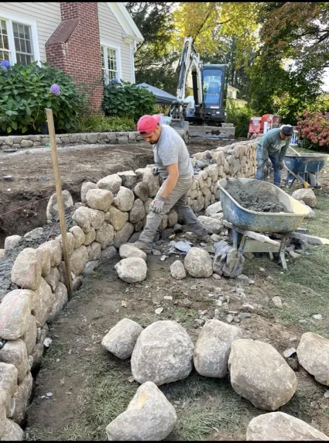 Stone wall construction in progress