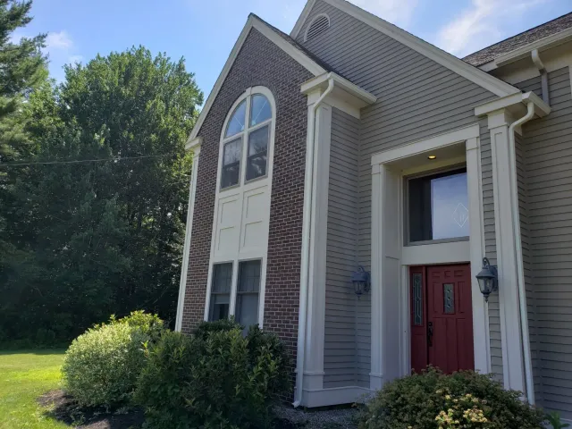 Seamless gutters on brick entryway