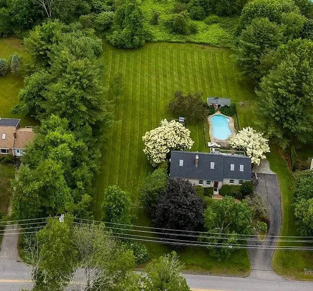 Electric lawn mowing service cutting residential lawn in Stratham NH