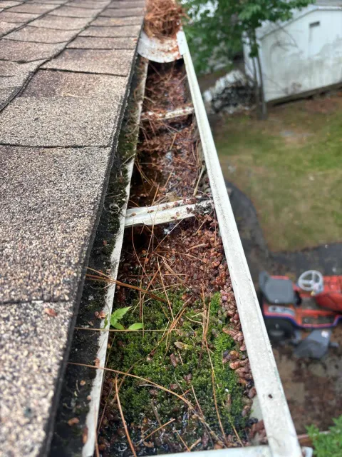 Before: old gutter on the same house