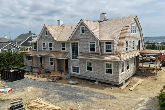 Copper seam porch roofs and cedar shingle transitions