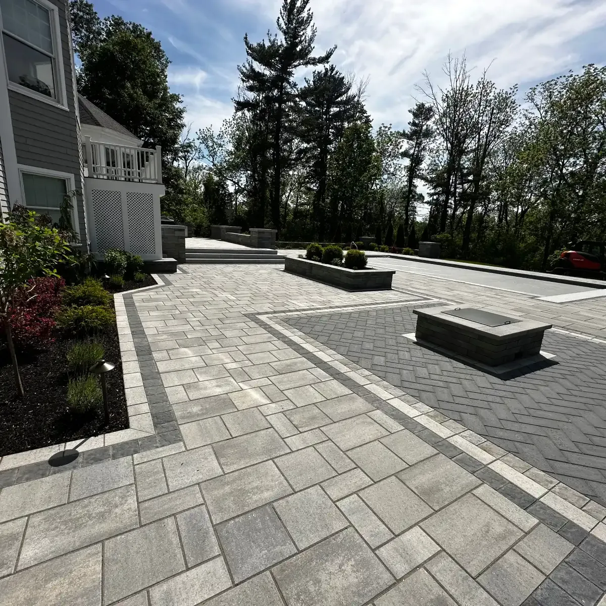 Paver patio with gas firepit and raised planter