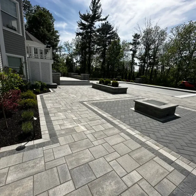 Paver patio with gas firepit and raised planter