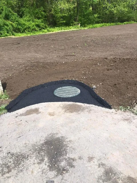 Asphalt Patch and Berm Around Catch Basin