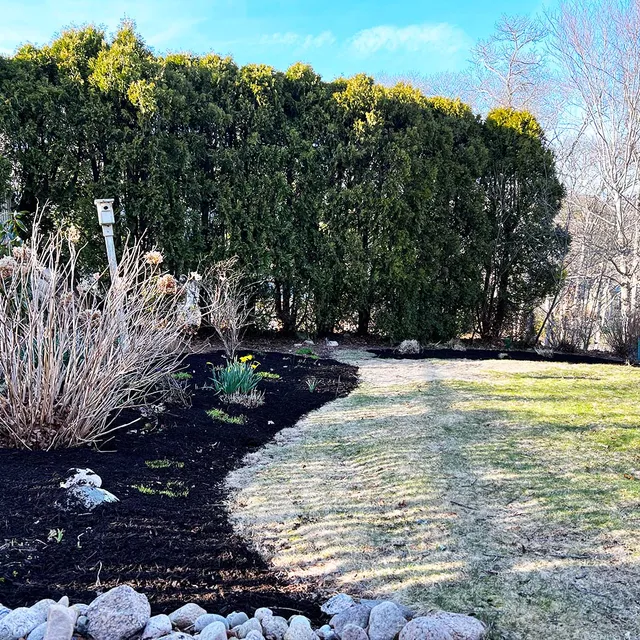 picture of flower bed with mulch for professional lawn care service near me in Falmouth, MA