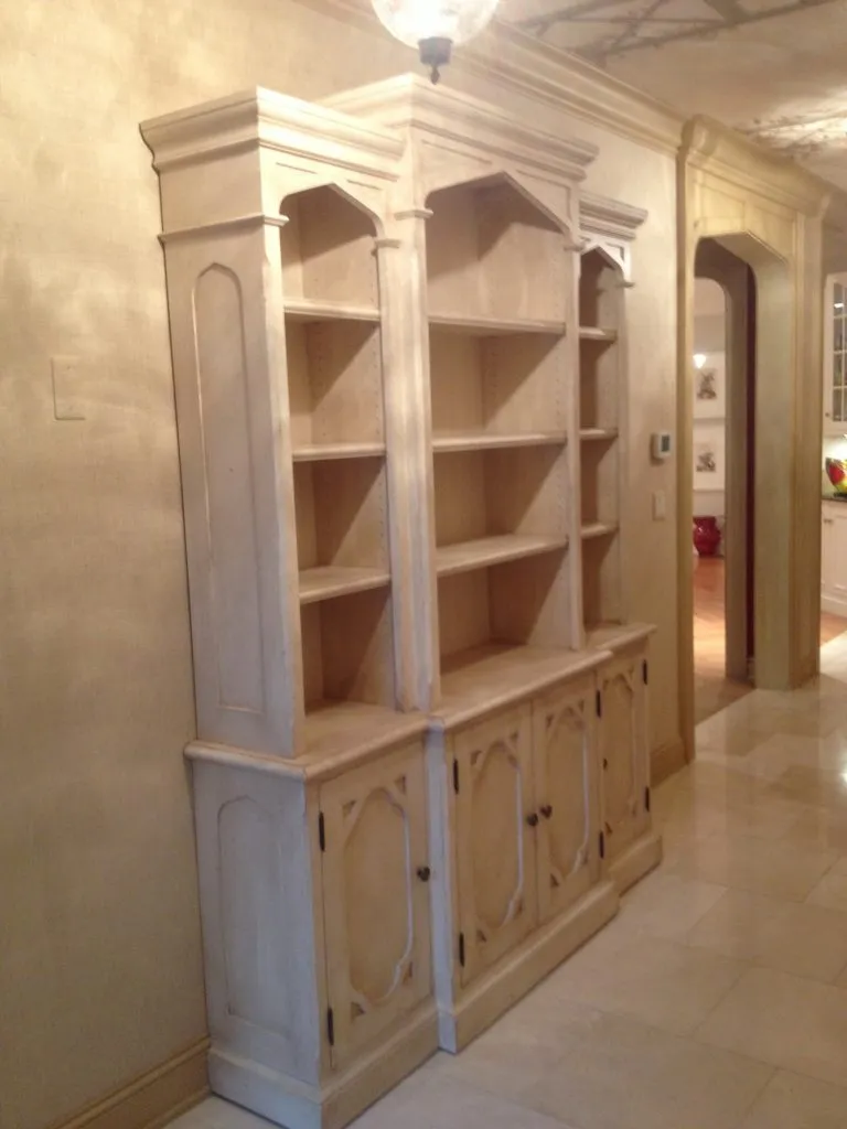 This Bookcase wall unit in Wellesley has Gothic styling and a lightly distressed paint finish.