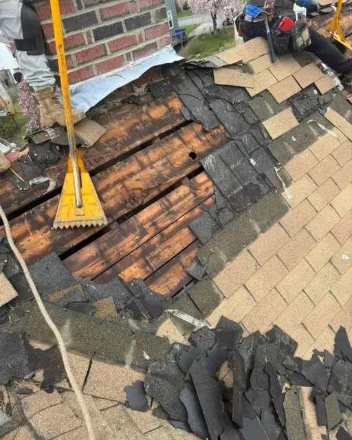 A Class Chimney crew rebuilding a chimney flashing and roofline on a Connecticut home