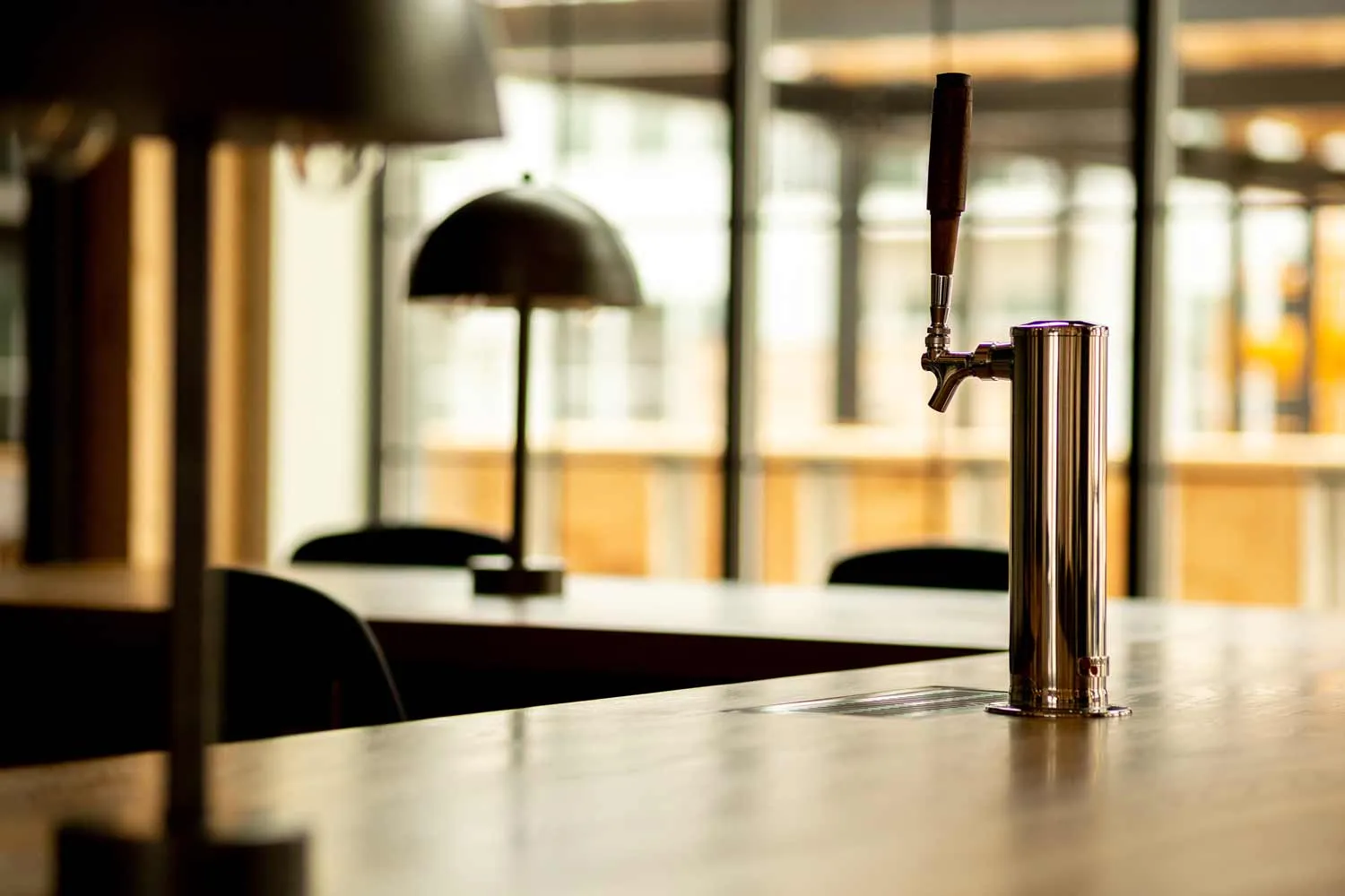 Bar detail — tap tower set into custom hardwood counter