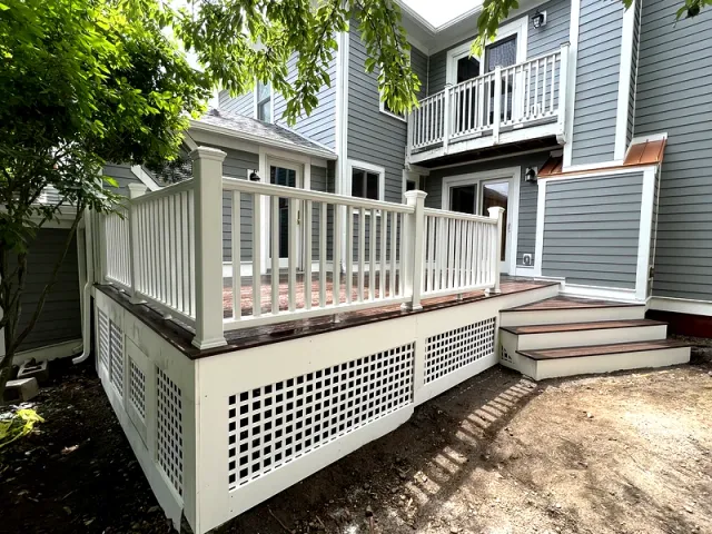 Deck with lattice skirt and white railing