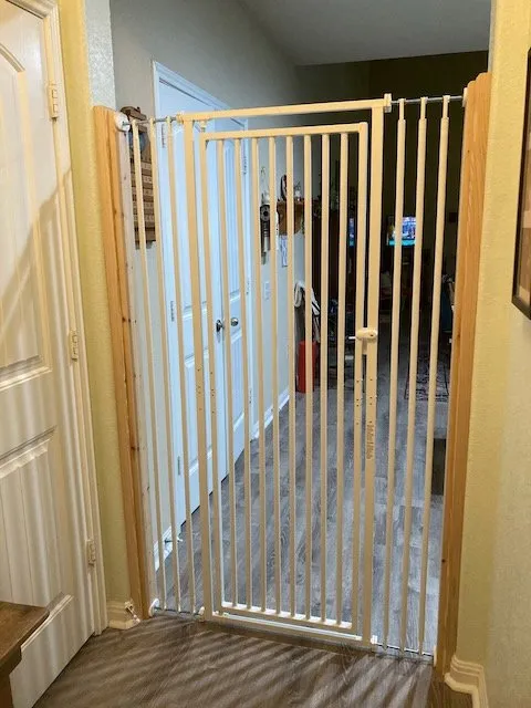 built out doorway to accomodate tall metal cat gate