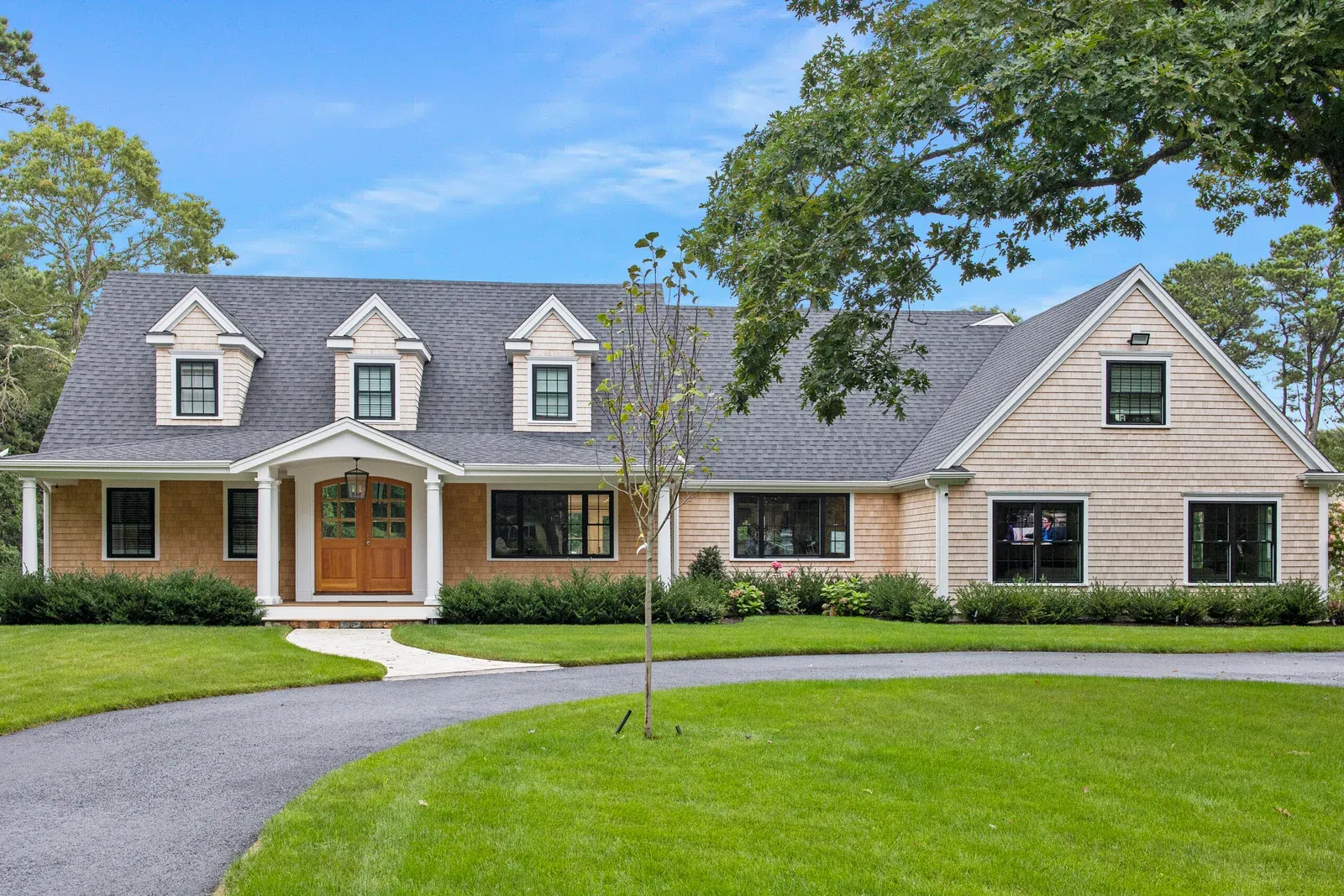 Custom landscape design and installation project in Barnstable, Cape Cod by GADE Masonry & Landscaping.