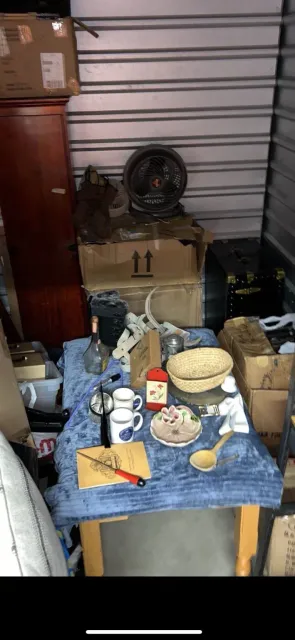 Storage unit filled with furniture, boxes and household belongings