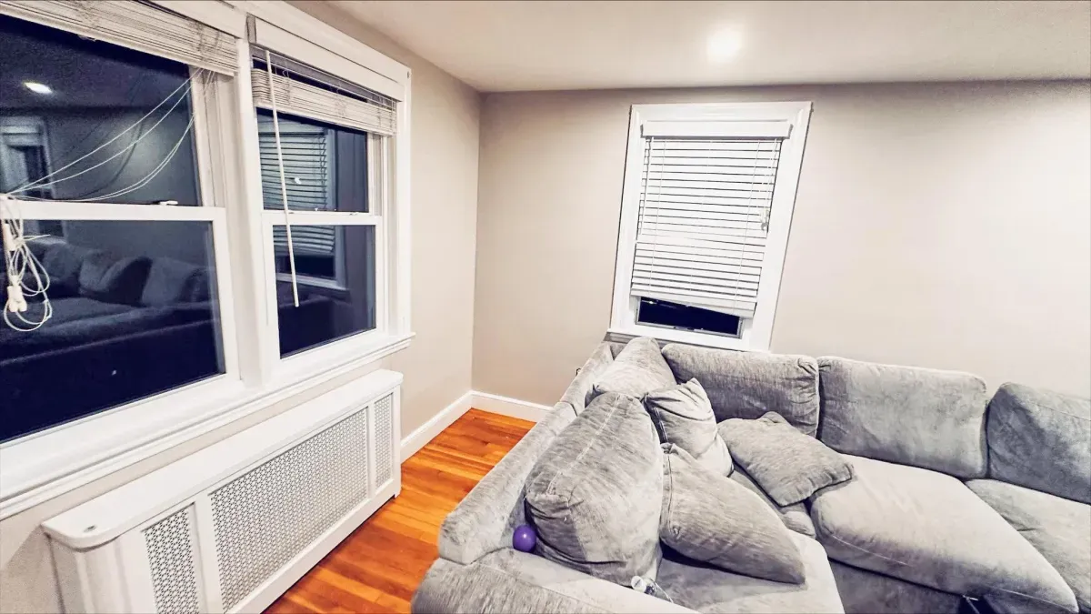 Interior house painting showing freshly painted walls and trim in a Waltham, MA residential home