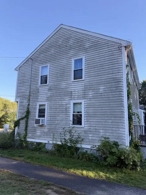 House siding before washing, gray with mildew