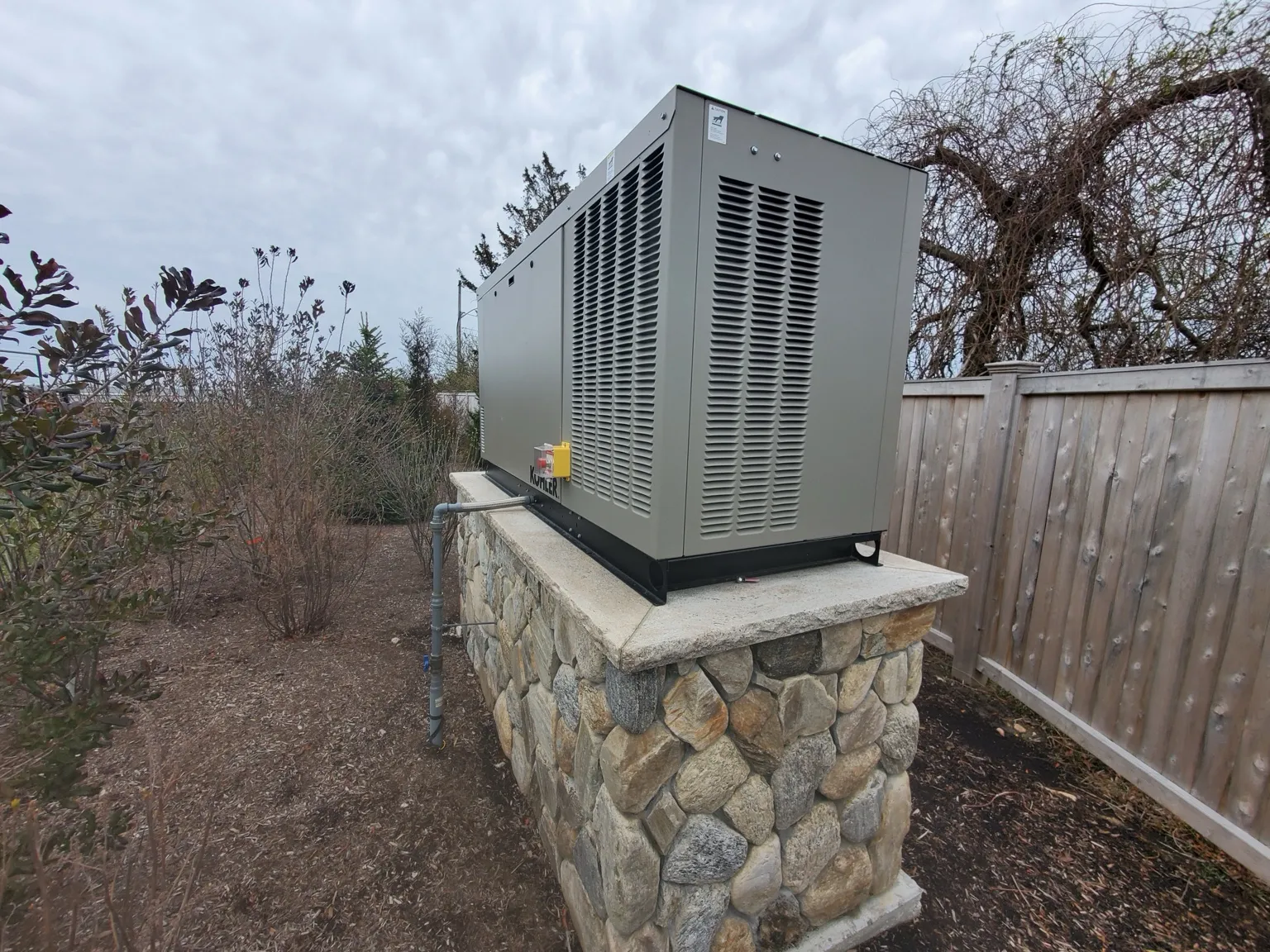 Standby generator on stone base