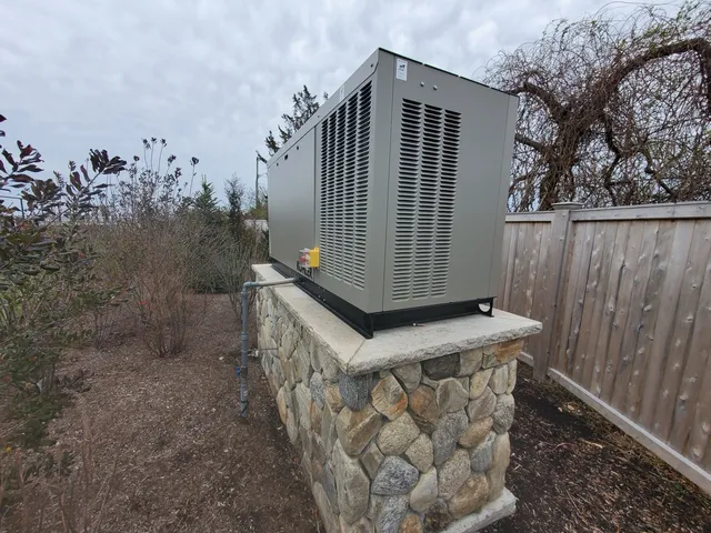 Standby generator on stone base
