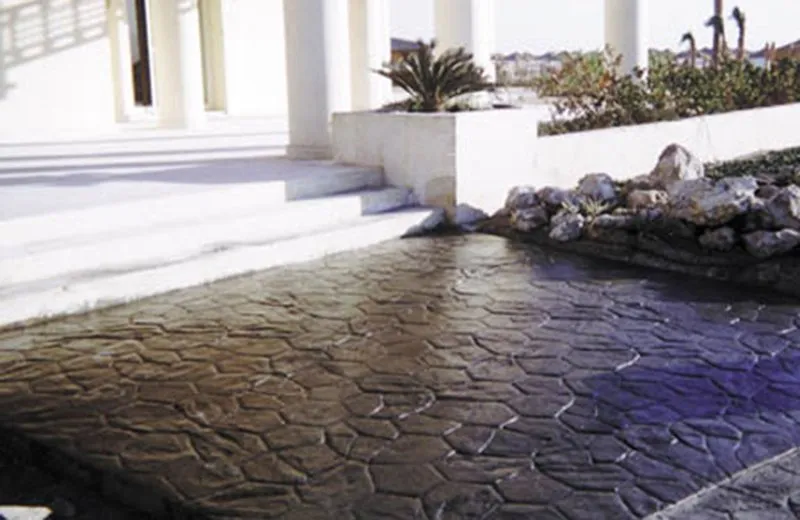 Stamped concrete patio with stone pattern and steps