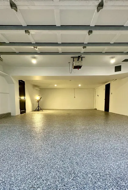 A room with white walls and black floor