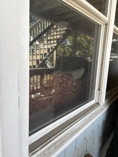 Dirty porch window with dust and grime before professional cleaning in Hull MA