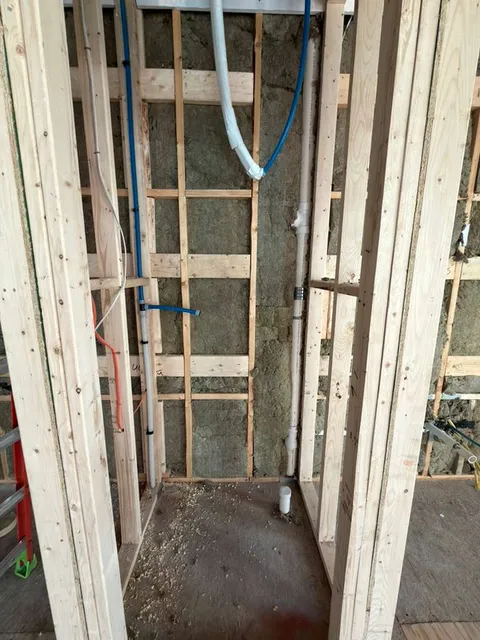 Water heater rough plumbing with main hot and cold lines installation