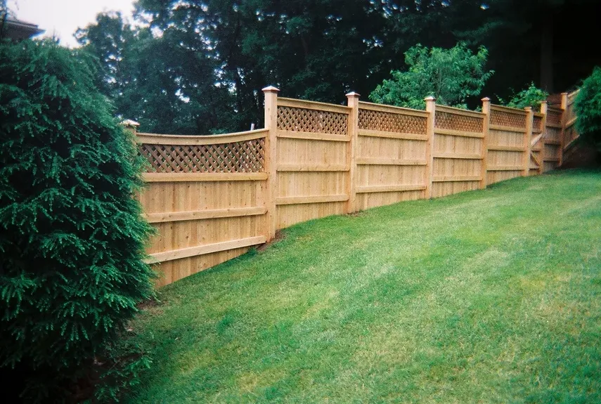 Lattice-top cedar fence along a lawn