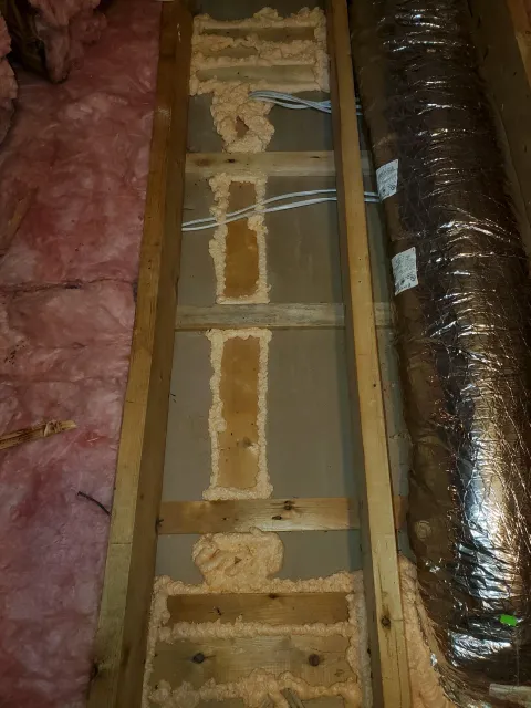 Air sealing performed in Attleboro to eliminate drafts and improve energy efficiency throughout the home.