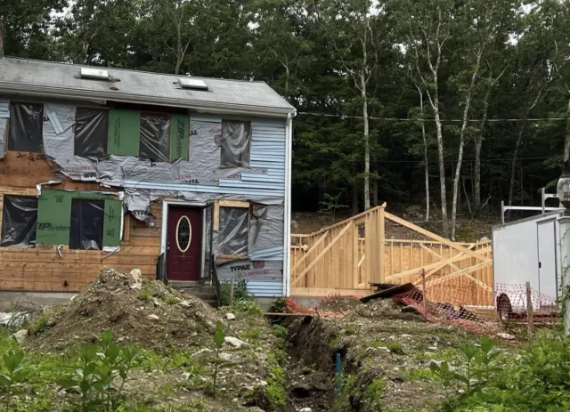 Wood framing for a custom rear home addition by FJ Global