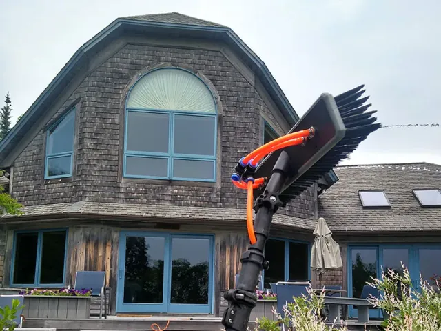 a house with a water pole in front of it