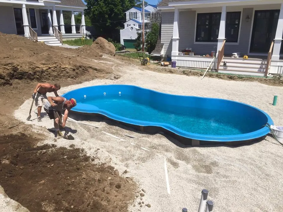 Fiberglass pool installation in progress