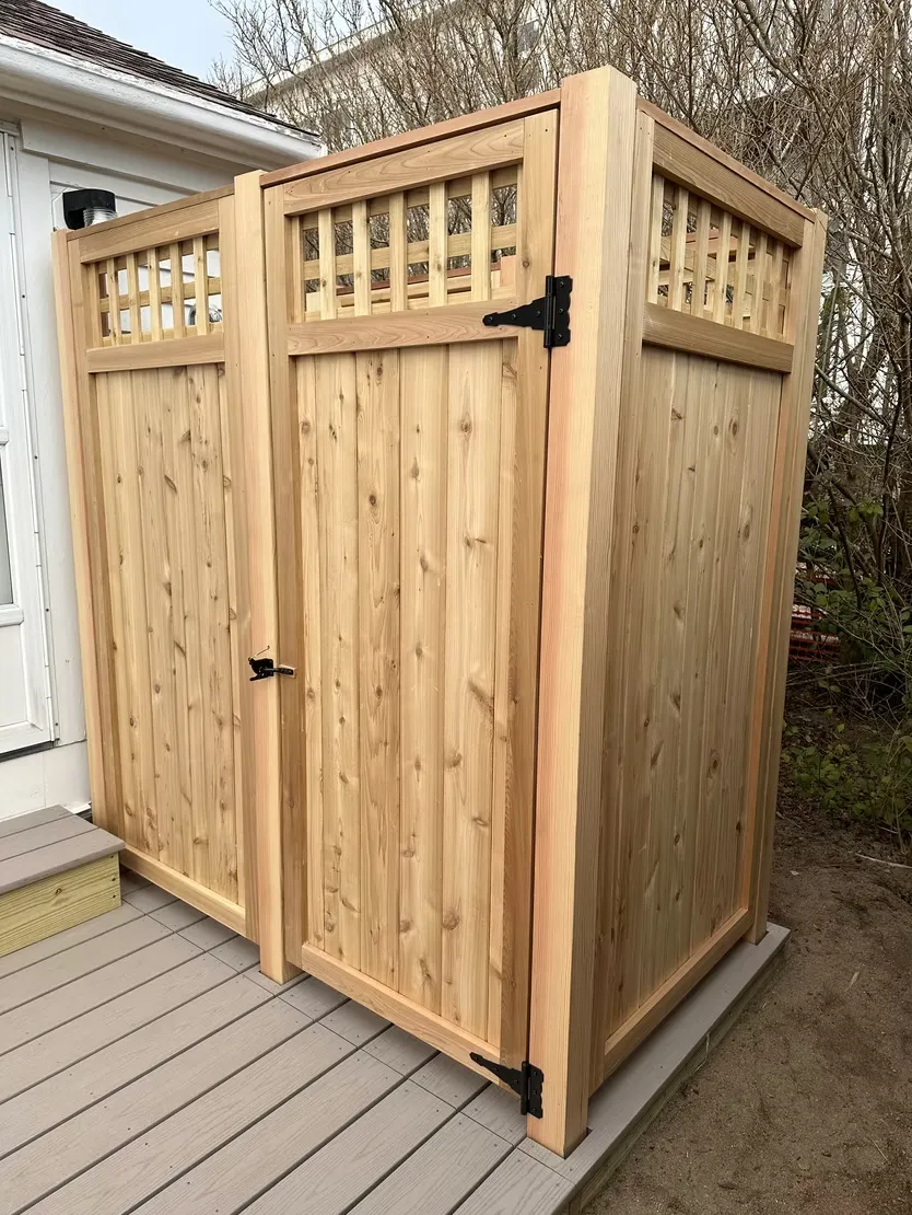 Custom cedar outdoor shower enclosure with lattice detail