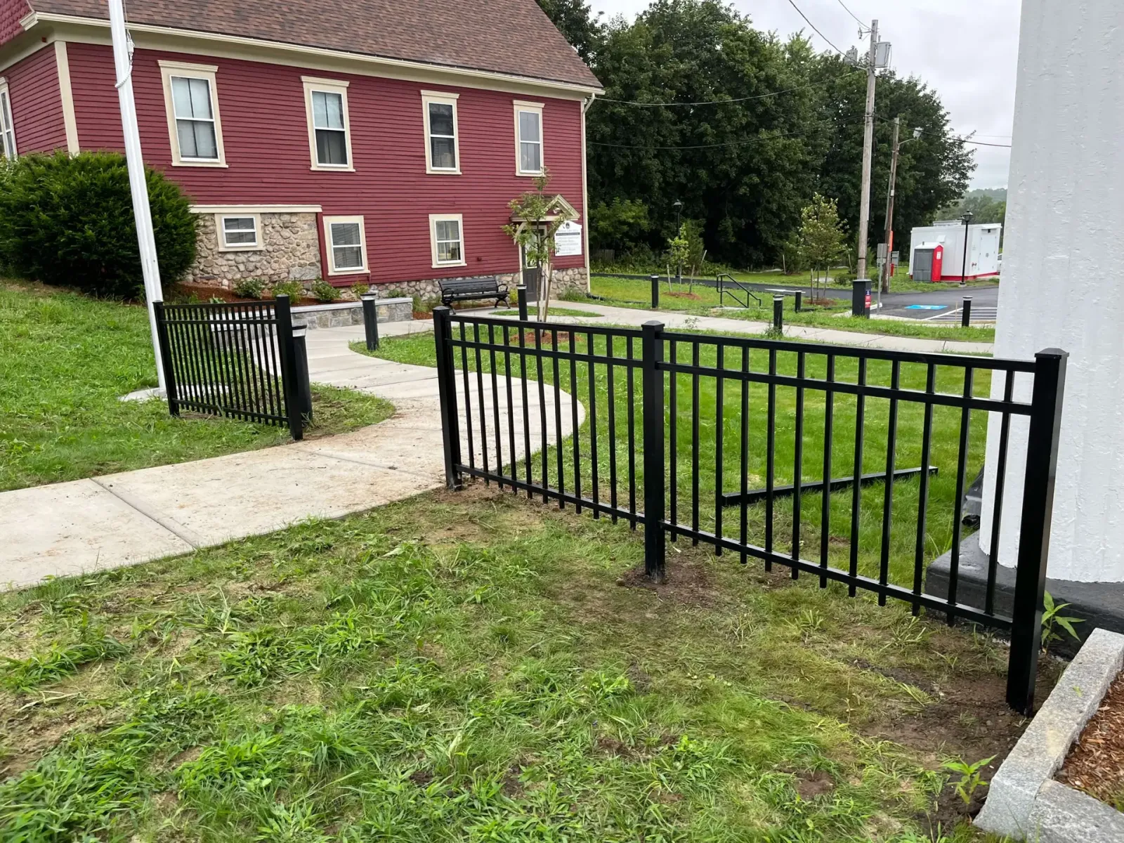 Black ornamental aluminum fence installed in West Newbury, Massachusetts by Olympic Fence Company.