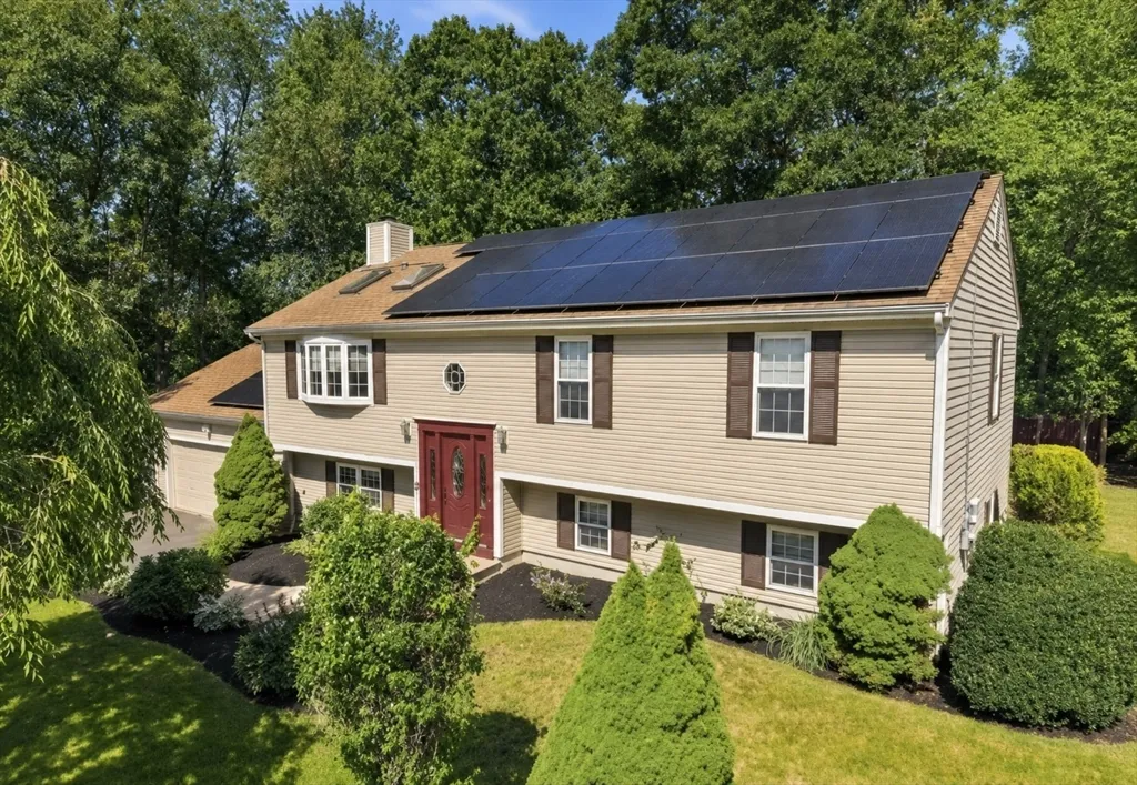 A RARE FIND IN NORTH DARTMOUTH! 25 BUTTERFLY TRAIL OFFERS A SPACIOUS LOWER LEVEL WITH ITS OWN KITCHEN, FULL BATH, BEDROOM, AND LIVING AREA CREATING A COMFORTABLE AND VERSATILE SECOND LIVING SPACE. IDEAL FOR MULTI-GENERATIONAL LIVING, EXTENDED FAMILY, GUESTS OR ADDITIONAL SPACE FOR YOUR OWN ENJOYMENT & CONVENIENCE. Located in desirable Butterfly Acres, this raised ranch is tucked at the end of a quiet cul-del-sac, surrounded by lovely homes and peaceful wooded backdrop. The main level showcases a stunning, recently renovated eat-in kitchen featuring white cabinetry, an apron-front farmhouse sink, sparkling gray & white granite countertops, stainless steel appliances, a vented chimney-style range hood and a spacious center island with built-in microwave. Cathedral ceilings, distinctive lighting, and abundant natural light create a welcoming gathering space. The inviting sun-filled living room showcases a cozy fireplace, a stunning bow window, soaring skylights, elegant designer lighting and freshly painted walls. Down the hall are three bedrooms, including a primary suite with its own full bath, plus an additional full bathroom. Just off the kitchen, French doors open to a heated sunroom wrapped in windows, offering picturesque views of the backyard's charming perennial gardens and peaceful wooded backdrop. The finished lower level offers a second living area with its own private entrance, spacious bedroom with recessed lighting and 2 double closets, beautifully renovated kitchen mirroring the finishes upstairs, dining area, living room with custom built-in shelving, full bath, and its own heated sunroom. A separate laundry area, utility room, and oversized two-car garage complete the lower level. Additional highlights include owned solar panels for significant energy savings (roof & solar panels installed 2019), a private backyard that backs to nothing but tranquil woods. If you’re seeking a beautiful home in one of Dartmouth’s most desirable neighborhoods, 25 Butterfly Trail is a rare opportunity you won’t want to miss. This is an estate sale requiring court approval - closing is anticipated within approximately 60 days after the Purchase and Sale Agreement is signed.