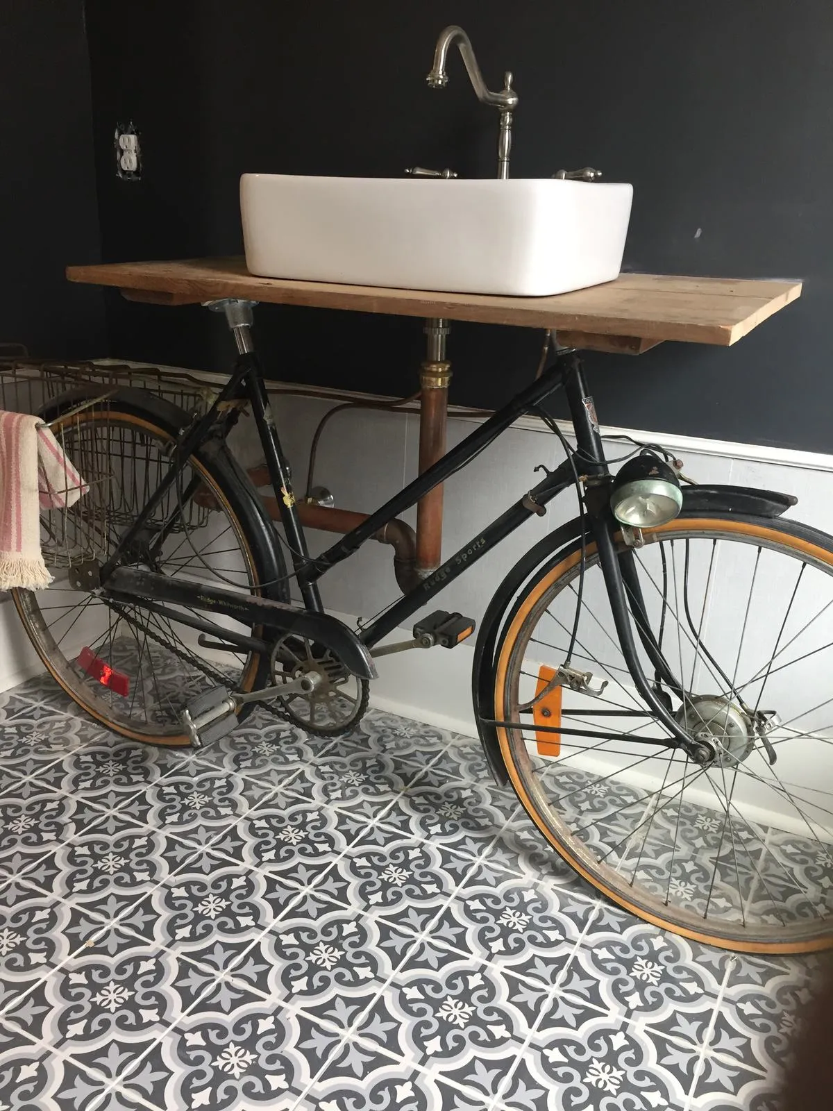 Custom bicycle sink vanity fabricated and plumbed by Ferguson Plumbing Design
