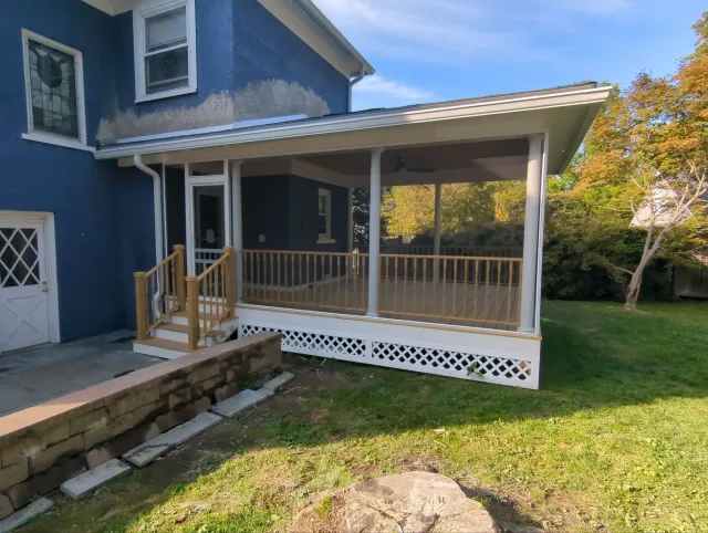 Screened porch addition with architectural columns and a hip roof in Pittsfield, MA