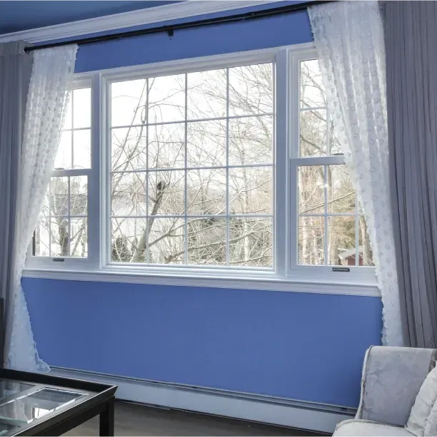 A renovated window inside of a home's blue bedroom