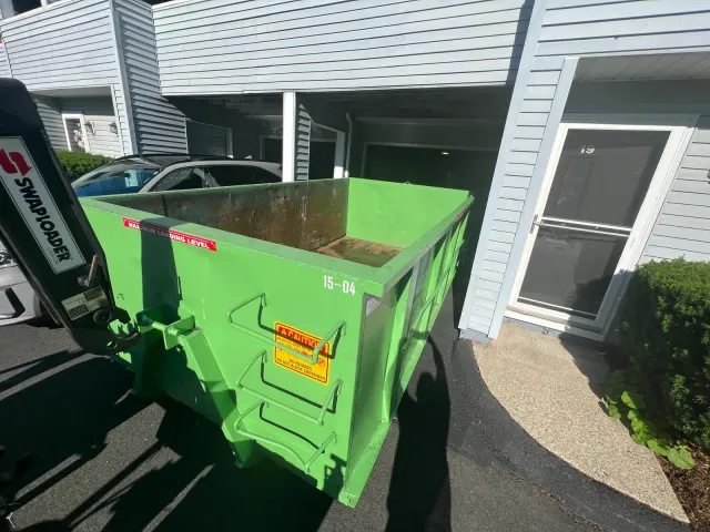 Dumpster delivery at residential complex